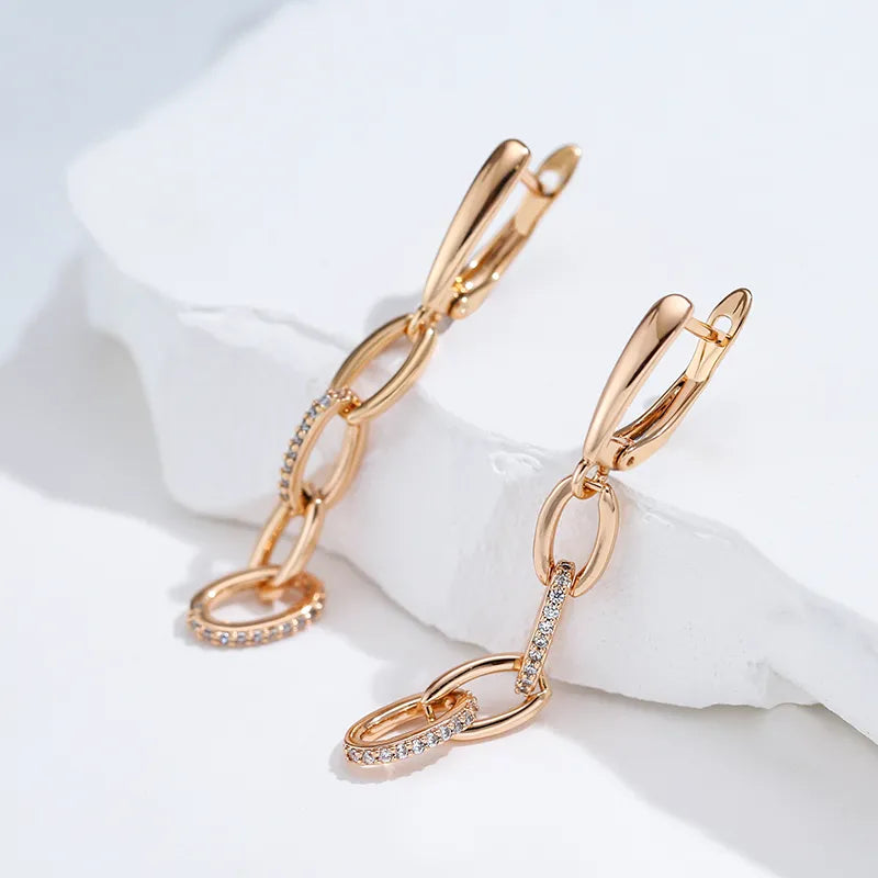 Boucles d'oreilles pendantes anneaux et zircons, bijou en plaqué or rose et en zircons naturels