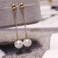 Boucles d'oreilles pendantes Perles beige ivoire, bijou en plaqué or et en acrylique