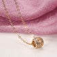 Collier pendentif exotique et ajouré, bijou en plaqué or rose et en zircons naturels
