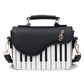 Sac à bandoulière design piano, noir et blanc, en simili-cuir