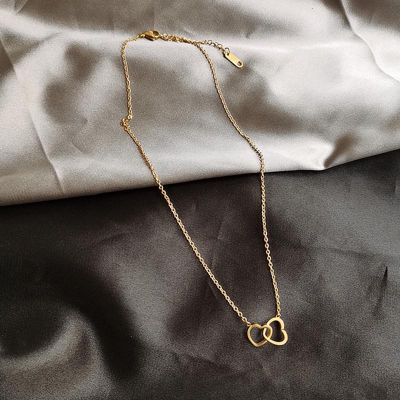 Collier coeurs enlacés, bijou en acier inoxydable doré