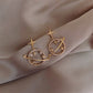 boucles d'oreilles astres avec zircons blancs