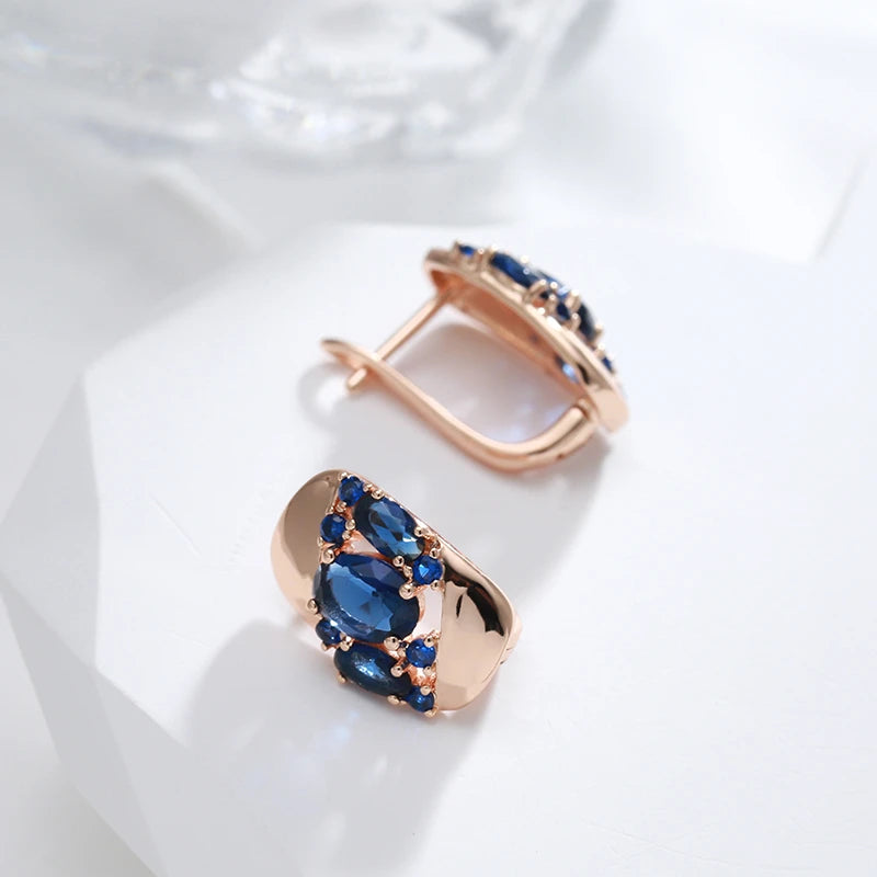 Boucles d'oreilles zircons bleu saphir, bijou en plaqué or rose 585 (14 carats) et en zircons naturels
